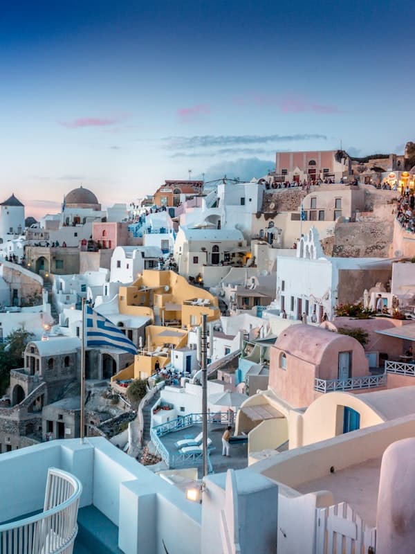 Blue-domed churches above the caldera at Oia, Santorini